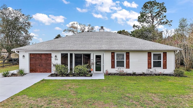 ranch-style home with a front lawn, concrete driveway, roof with shingles, a chimney, and an attached garage