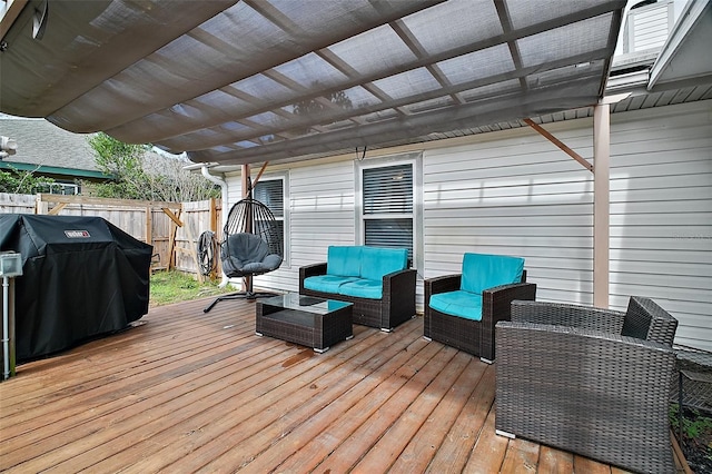 wooden deck featuring fence, an outdoor hangout area, a pergola, and area for grilling