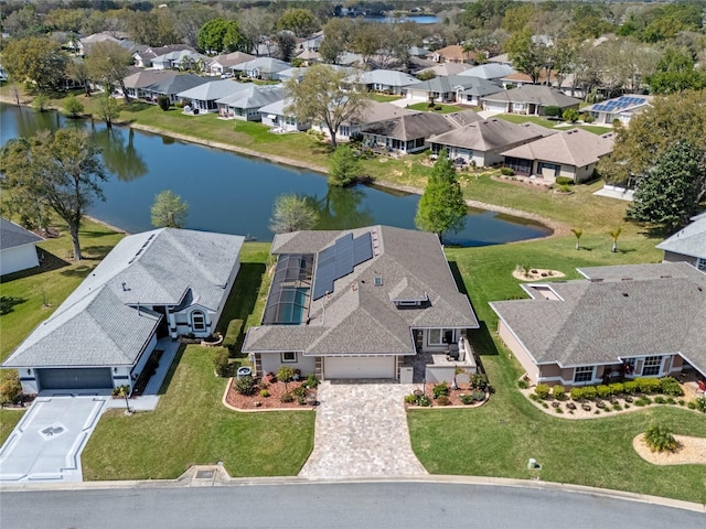 bird's eye view with a water view and a residential view