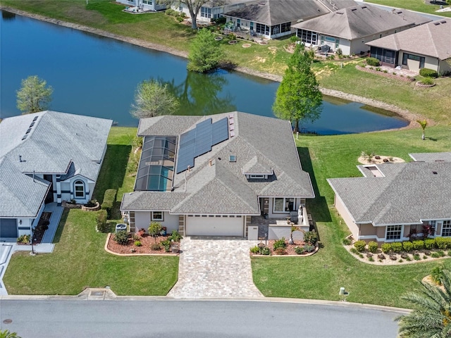 bird's eye view featuring a water view and a residential view