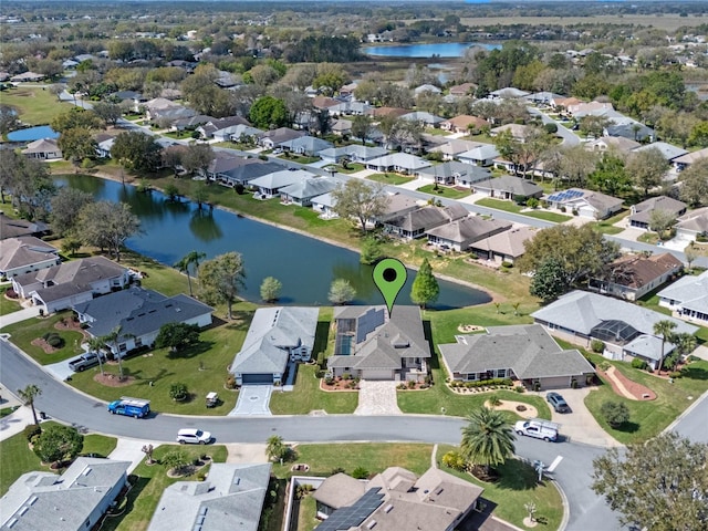 aerial view with a residential view and a water view