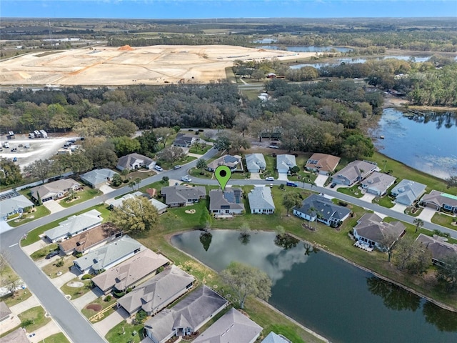 aerial view with a water view and a residential view