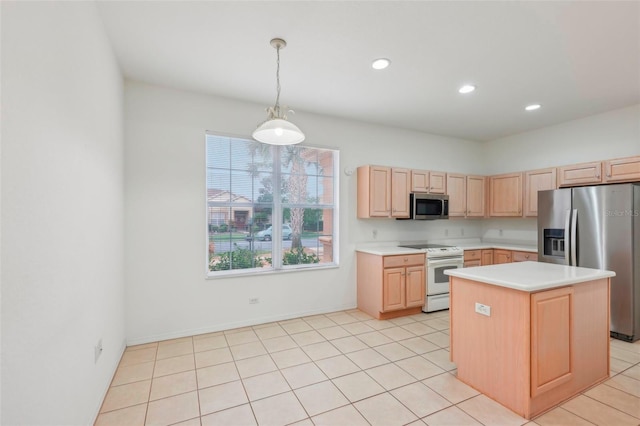 kitchen featuring decorative light fixtures, recessed lighting, light countertops, appliances with stainless steel finishes, and light brown cabinets