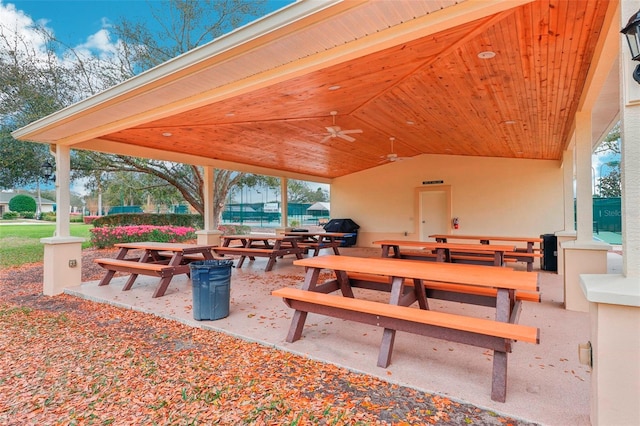 view of community with a patio area and outdoor dining area