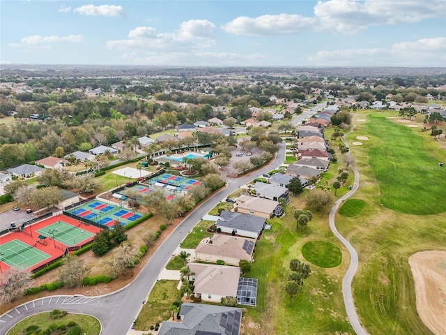 birds eye view of property featuring golf course view and a residential view