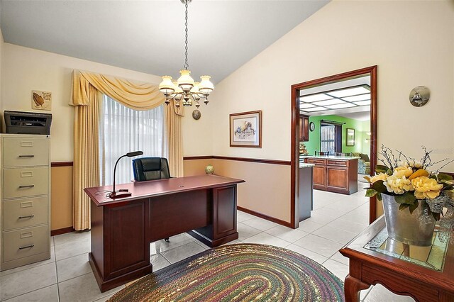 office area featuring lofted ceiling, light tile patterned flooring, baseboards, and a notable chandelier