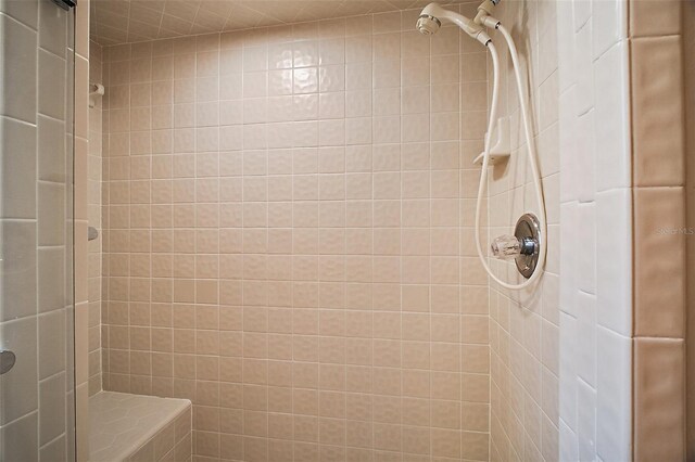 bathroom with a tile shower