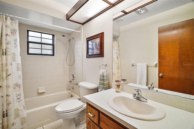 bathroom with visible vents, vanity, toilet, and shower / tub combo with curtain