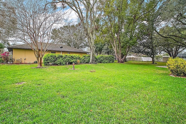 view of yard with fence