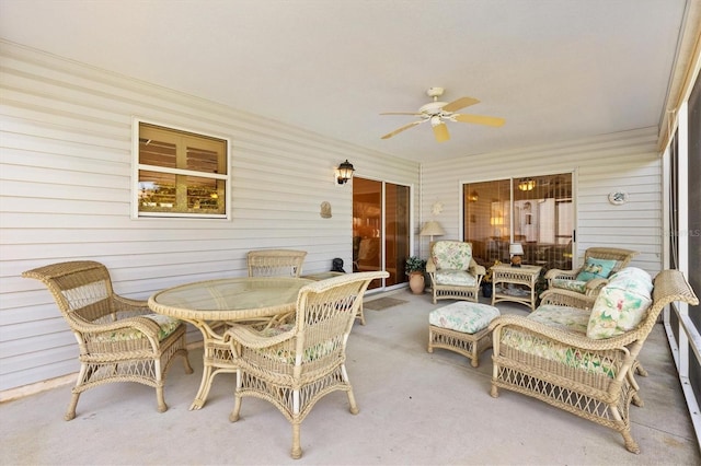 sunroom / solarium featuring ceiling fan