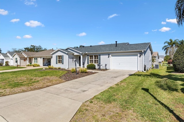 ranch-style home featuring a garage, concrete driveway, and a front lawn