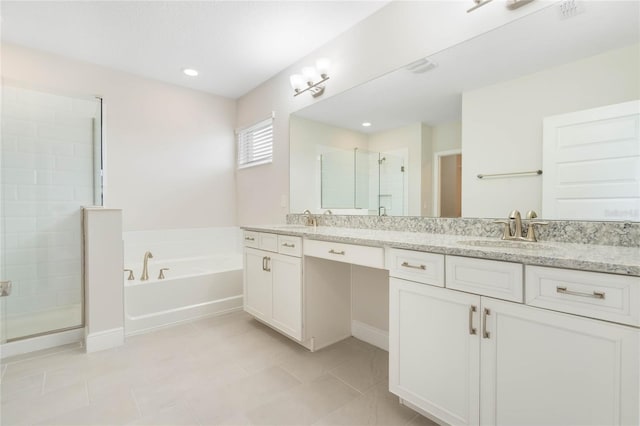 full bath with a garden tub, double vanity, a sink, and a shower stall