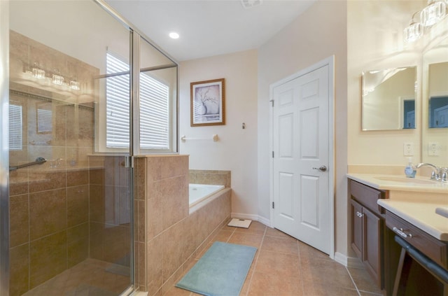 full bath with baseboards, tile patterned floors, a garden tub, vanity, and a shower stall