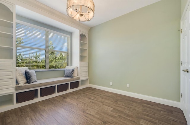 mudroom with built in features, a notable chandelier, baseboards, and dark wood-type flooring