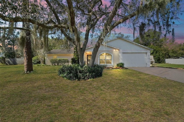 single story home with a garage, concrete driveway, a front yard, and fence