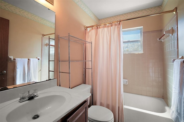 bathroom with shower / tub combo, vanity, and toilet