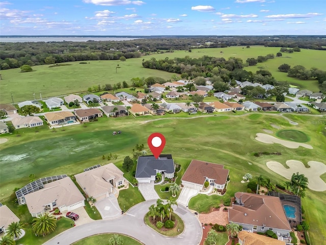 aerial view with view of golf course and a residential view