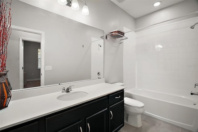 bathroom with vanity, tile patterned flooring, bathtub / shower combination, and toilet