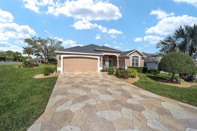 ranch-style home with a garage, a front yard, driveway, and stucco siding