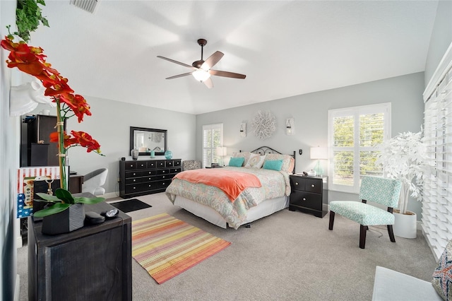 bedroom featuring carpet flooring, visible vents, and a ceiling fan