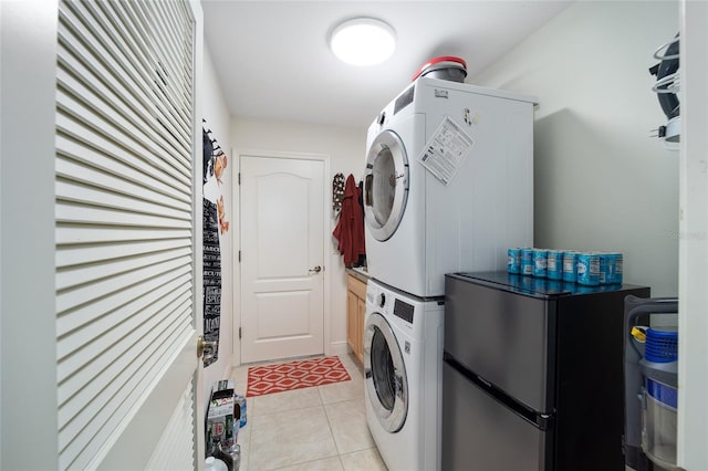 clothes washing area featuring laundry area and stacked washer and clothes dryer