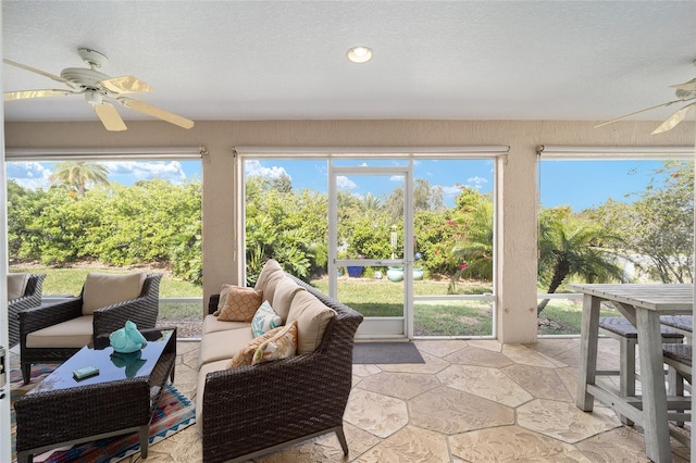 sunroom / solarium with plenty of natural light and a ceiling fan