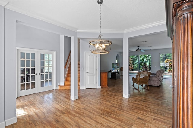 3430 Turningwind Ln, Winter Garden, FL 34787 - dining room featuring french doors, stairs, baseboards, a chandelier, and ornamental molding