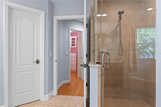 3430 Turningwind Ln, Winter Garden, FL 34787 - bathroom featuring a stall shower, tile patterned floors, and baseboards