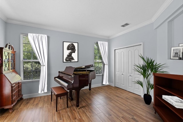 3430 Turningwind Ln, Winter Garden, FL 34787 - living area featuring ornamental molding, healthy amount of natural light, wood finished floors, and baseboards