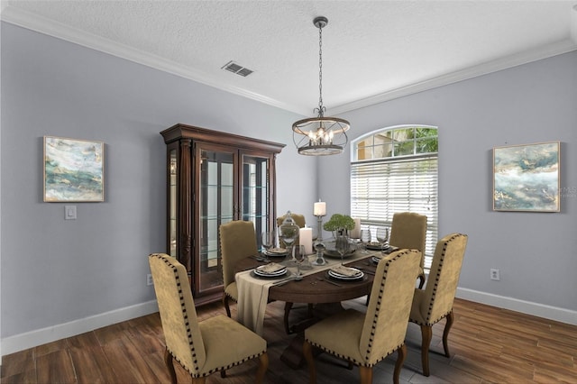 3430 Turningwind Ln, Winter Garden, FL 34787 - dining room with a chandelier, crown molding, wood finished floors, baseboards, and a textured ceiling