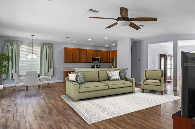 3430 Turningwind Ln, Winter Garden, FL 34787 - living area featuring a ceiling fan, healthy amount of natural light, dark wood-style flooring, baseboards, and recessed lighting