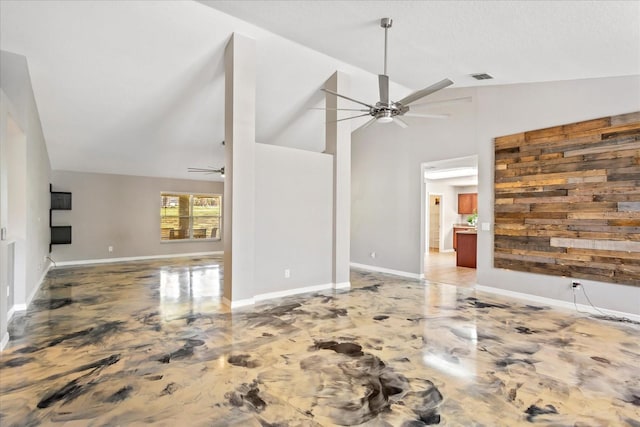 unfurnished living room with visible vents, baseboards, ceiling fan, marble finish floor, and high vaulted ceiling