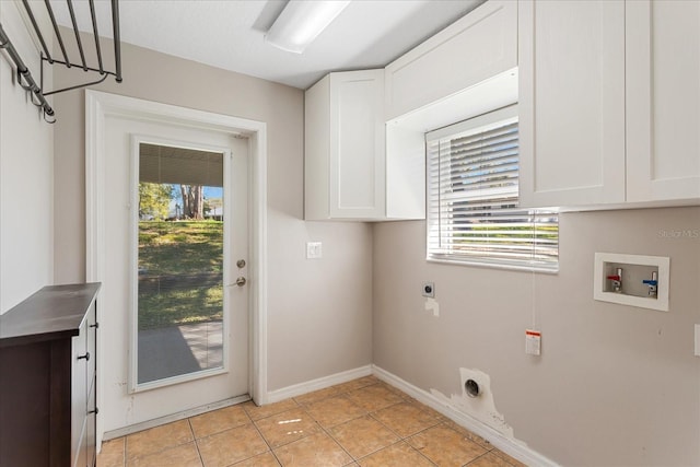 laundry room featuring cabinet space, light tile patterned floors, baseboards, hookup for an electric dryer, and washer hookup