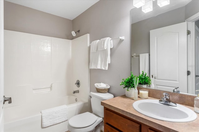 bathroom featuring toilet, shower / tub combination, and vanity