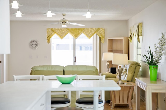 dining space featuring ceiling fan