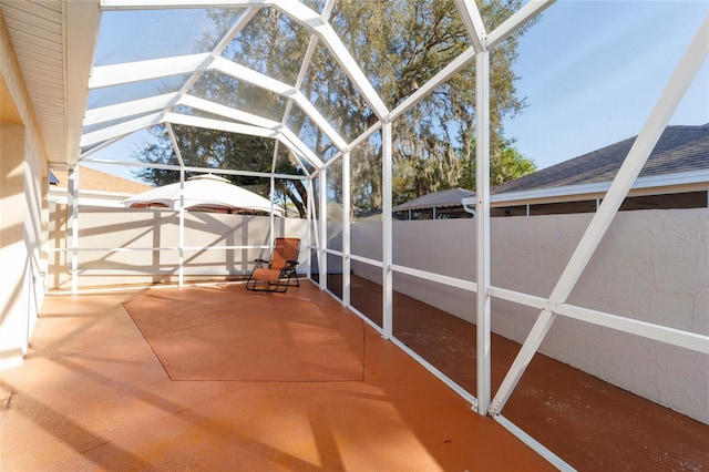 unfurnished sunroom with lofted ceiling