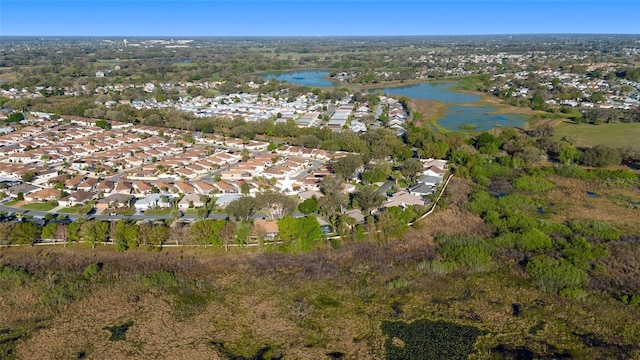 bird's eye view featuring a residential view and a water view