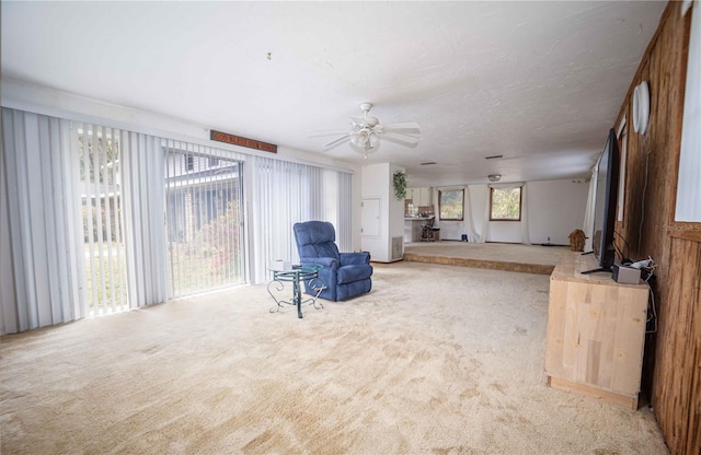 sitting room featuring carpet floors and ceiling fan