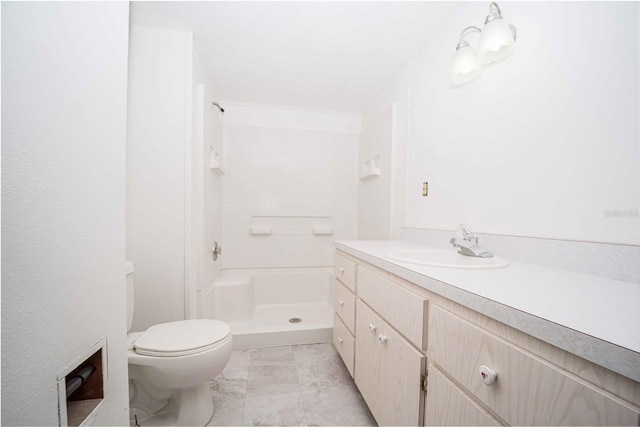 full bath with vanity, toilet, marble finish floor, and walk in shower