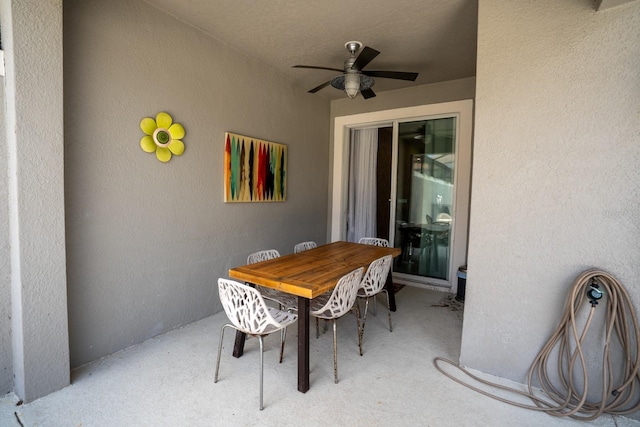 view of patio featuring ceiling fan and outdoor dining space