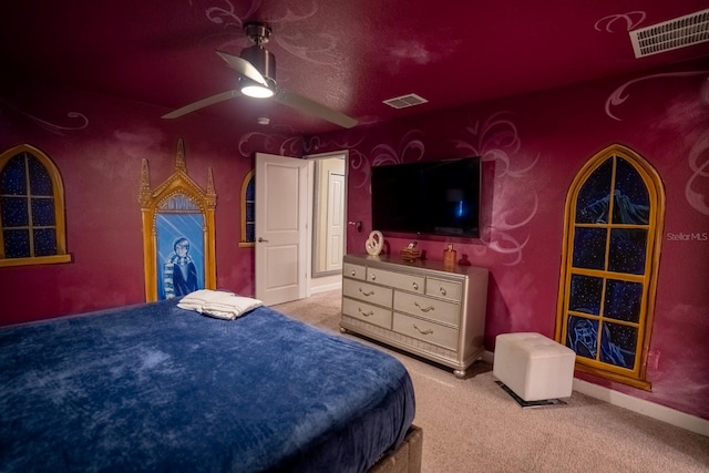 bedroom featuring carpet floors, visible vents, and a ceiling fan