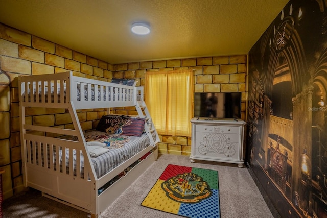 bedroom with carpet and a textured ceiling