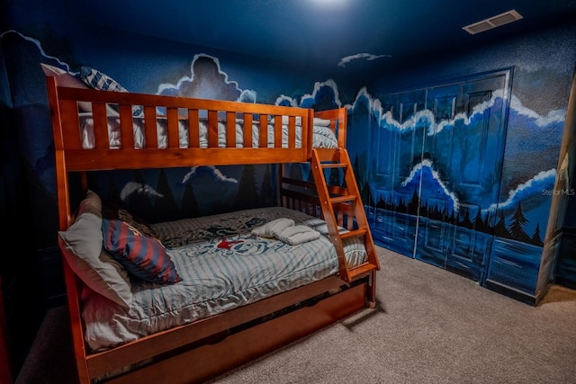 carpeted bedroom featuring visible vents