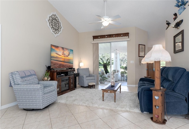 living area featuring light tile patterned floors, ceiling fan, high vaulted ceiling, and baseboards