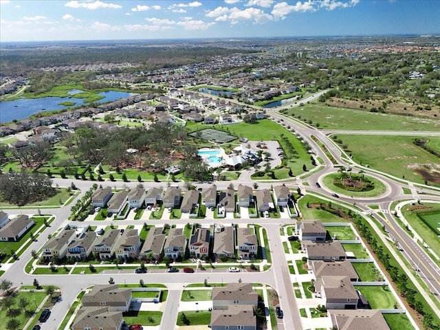 bird's eye view with a water view and a residential view