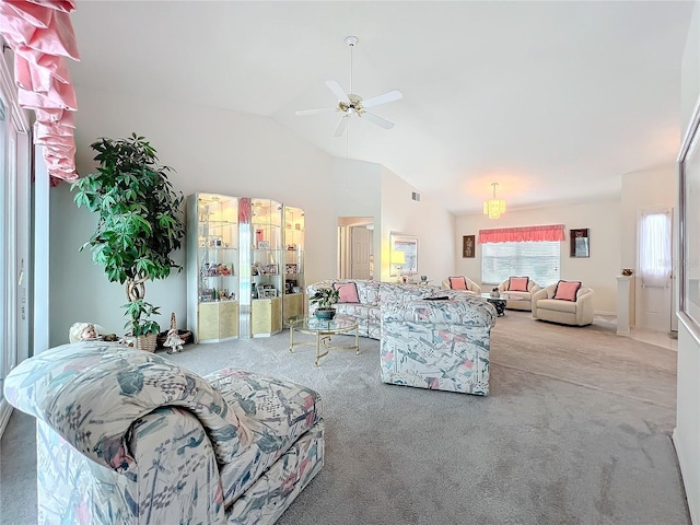 carpeted living room with vaulted ceiling, ceiling fan, and visible vents