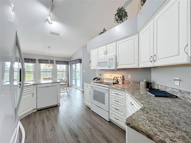 kitchen with white appliances, visible vents, a textured ceiling, light wood-style floors, and white cabinetry