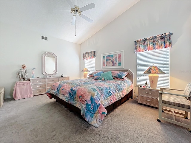 bedroom with ceiling fan, high vaulted ceiling, visible vents, and light colored carpet