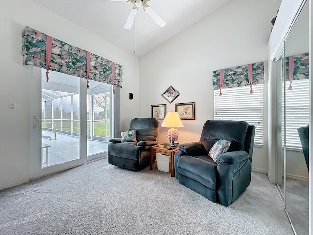 living area with lofted ceiling, a sunroom, carpet, and ceiling fan