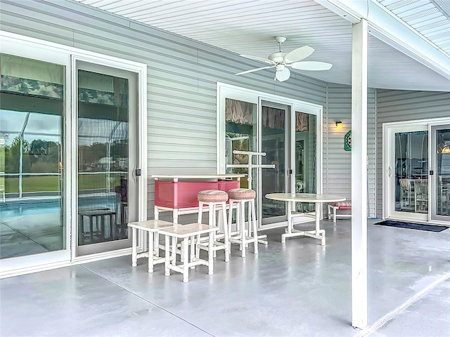 view of patio featuring ceiling fan